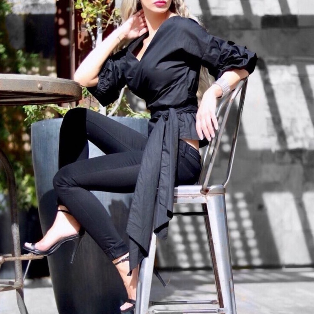 Black wrap top with puff sleeves
